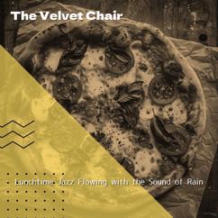 The Velvet Chair: Clinging Droplets on Window Panes